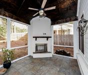 White Painted Brick Outdoor Fireplace in Brookhaven home built by Waterford Homes